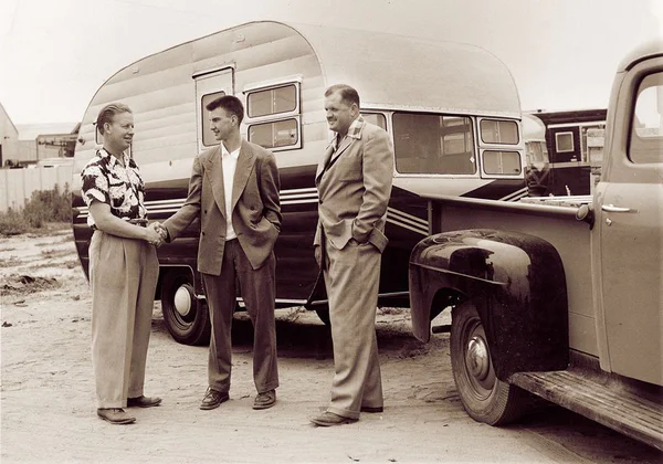 historical photo of men shaking hands